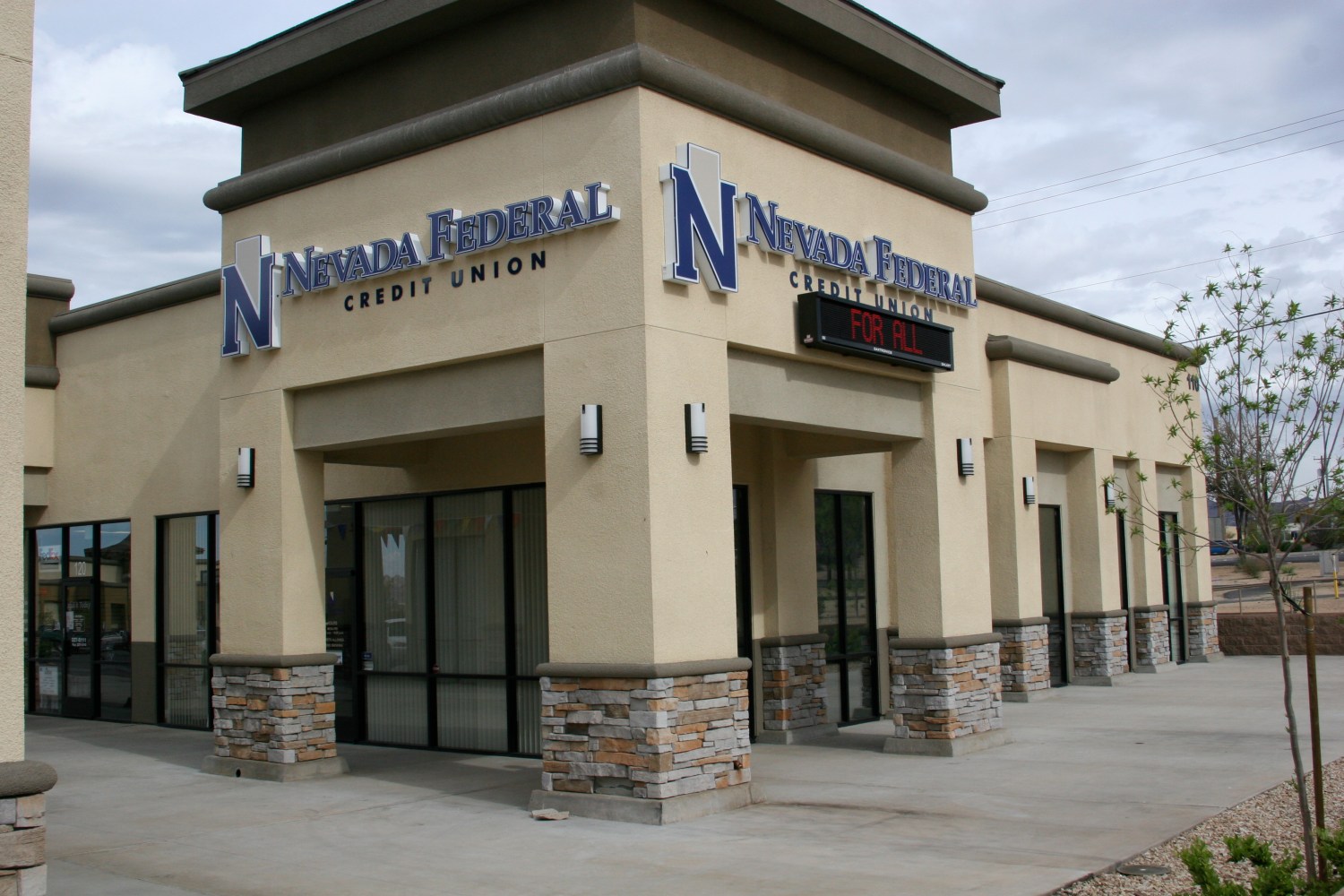 The Nevada Federal Credit Union is seen with a sign reading "for all."