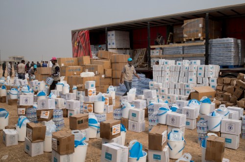 Aid workers prepare aid supplies from UNICEF, IOM, WFP and other organizations to be distributed to displaced Iraqis who fled villages south of Mosul, in Ibrahim Khalil village in Hamdaniyah, Iraq October 24, 2016. Picture taken October 24, 2016. UNICEF/Handout via REUTERS ATTENTION EDITORS - THIS IMAGE WAS PROVIDED BY A THIRD PARTY. FOR EDITORIAL USE ONLY. - S1AEUIZDIZAA