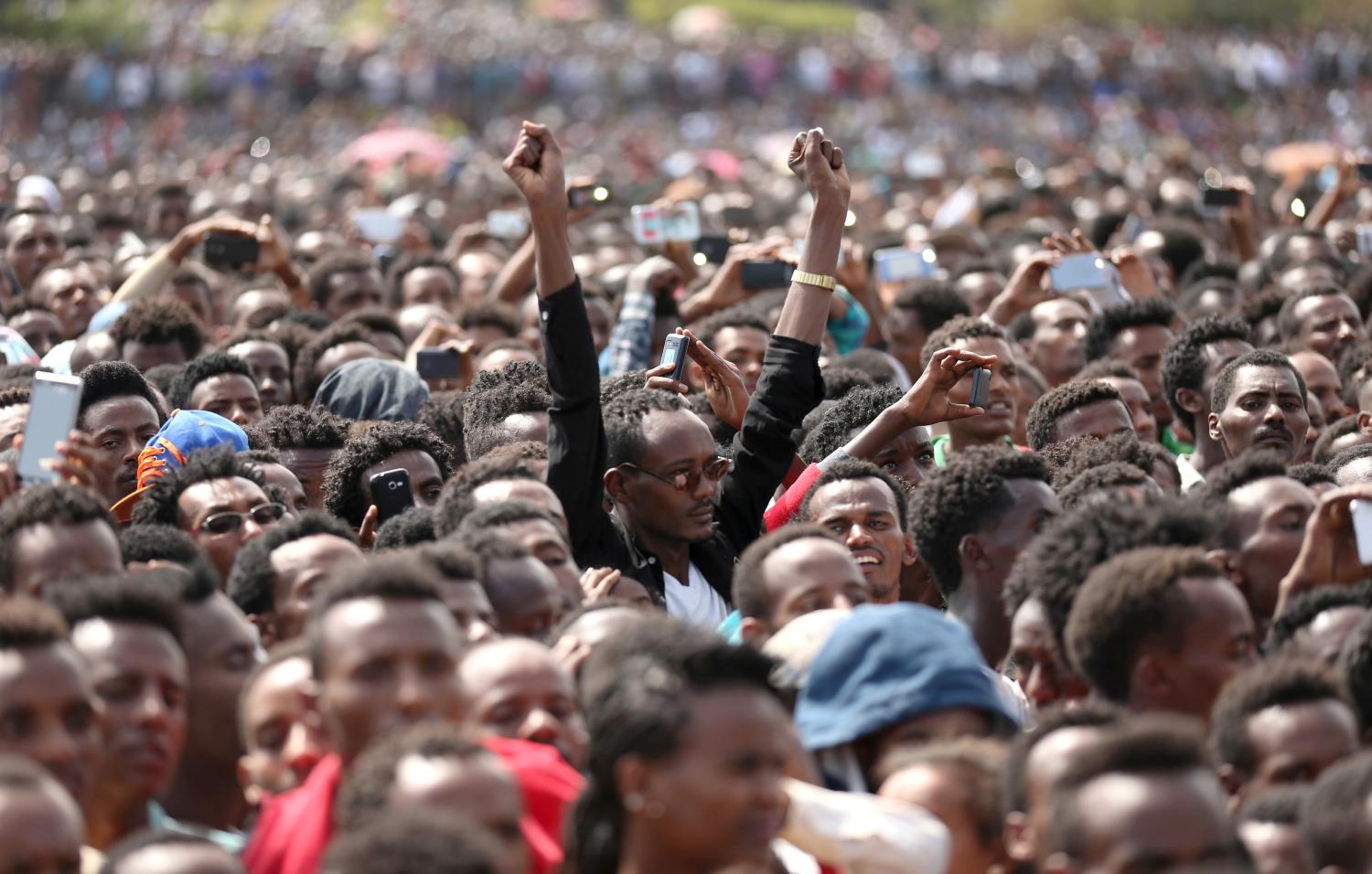 Residents attend a rally by Ethiopia's newly elected prime minister Abiy Ahmed during his visit Ambo in the Oromiya region, Ethiopia April 11, 2018. REUTERS/Tiksa Negeri - RC172DC0DAF0