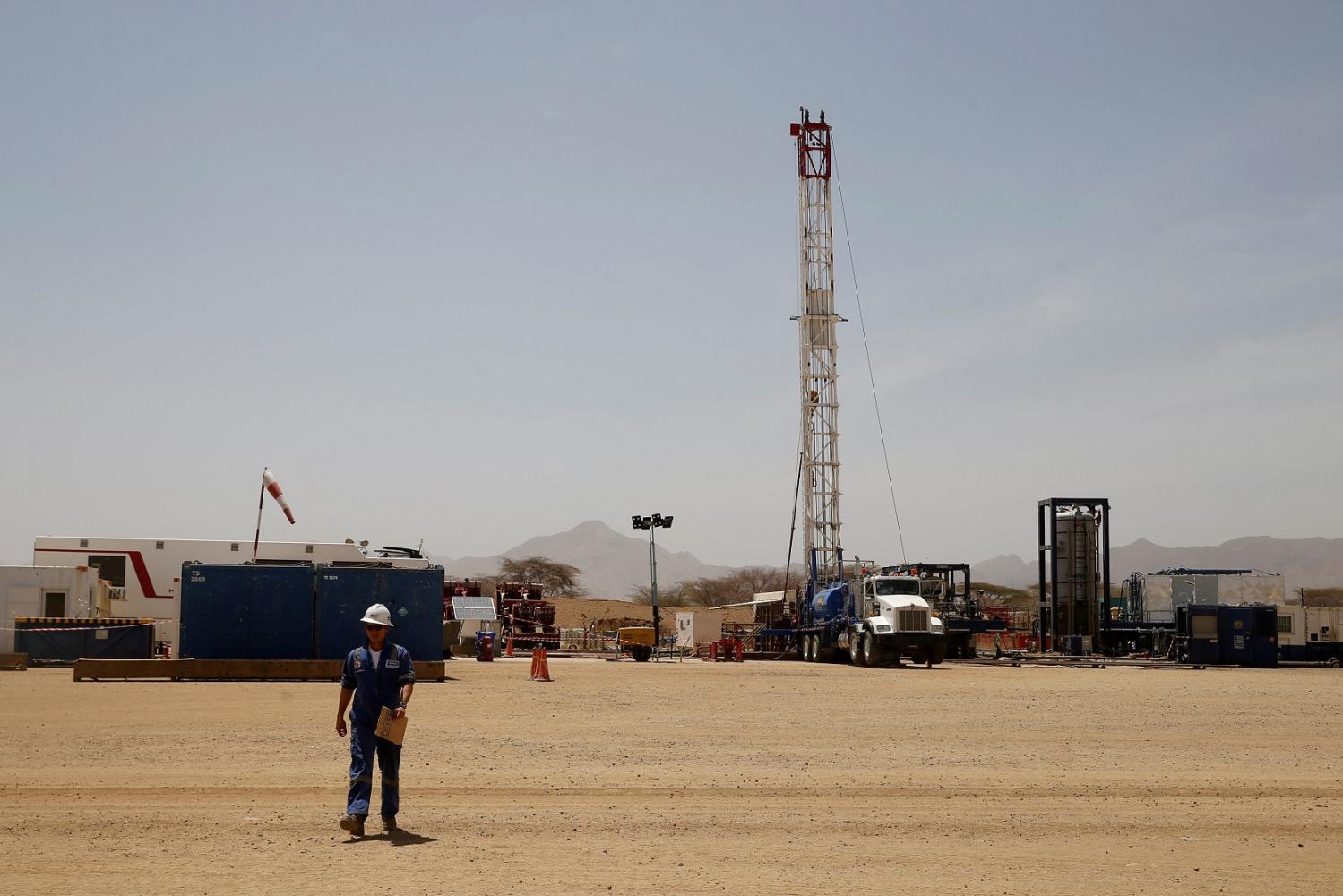 FILE PHOTO: A worker walks at a Tullow Oil explorational drilling site in Lokichar, Turkana County, Kenya, February 8, 2018. REUTERS/Baz Ratner/File Photo - RC1B8C49D650