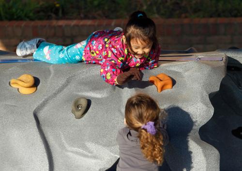 Four-year old Catherine Mawi (top) plays with three-year old Lillian Barnette (bottom) at the Frederick, Maryland Head Start facility March 13, 2012. When officials in Frederick County, Maryland voted last year to stop paying for the local Head Start preschool program, they  pointed to a nearly $12 million projected budget shortfall as proof that the mostly rural county could no longer afford it. Picture taken March 13, 2012. To match story USA-EDUCATION/HEADSTART  REUTERS/Gary Cameron   (UNITED STATES - Tags: EDUCATION POLITICS) - GM1E83F0CI701