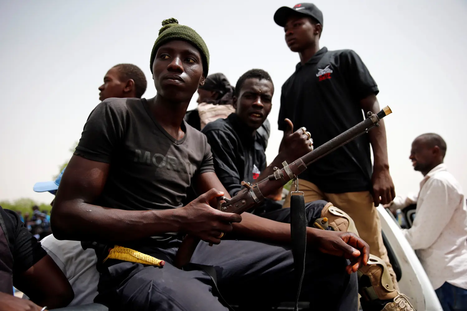 DATE IMPORTED: June 15, 2017 Members of the local militia, otherwise known as CJTF, sit in the back of a truck during a patrol in the city of Maiduguri, northern Nigeria June 9, 2017. Picture taken June 9, 2017. REUTERS/Akintunde Akinleye.
