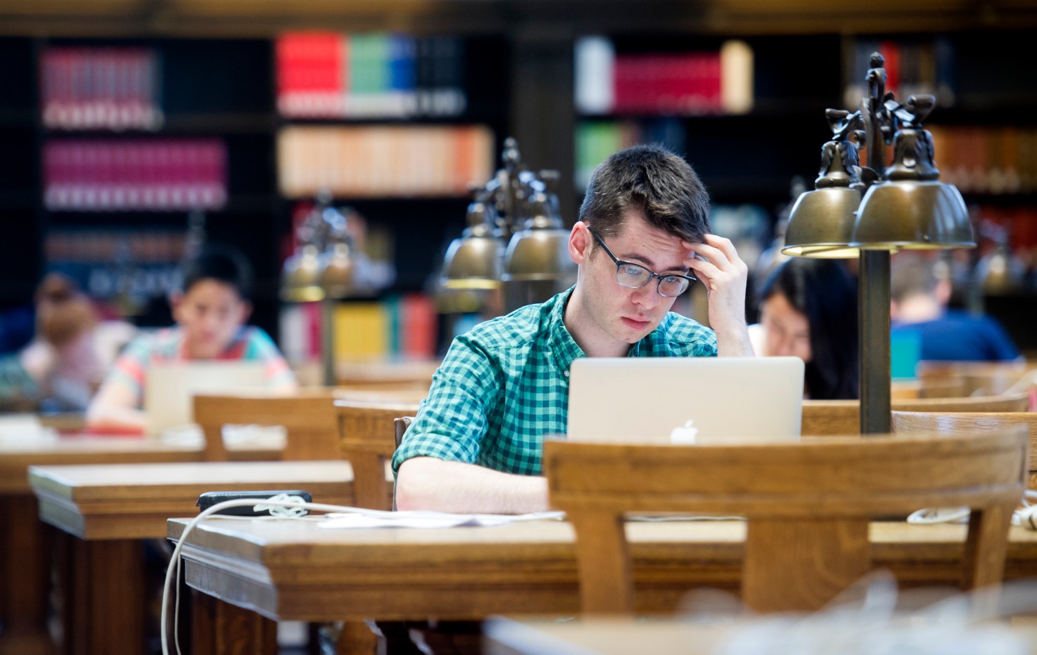 First-year law student Christopher Healy studies in Doe Library at the University of California at Berkeley in Berkeley, California May 12, 2014.    REUTERS/Noah Berger  (UNITED STATES - Tags: EDUCATION) - GF2EA5D0QYS01