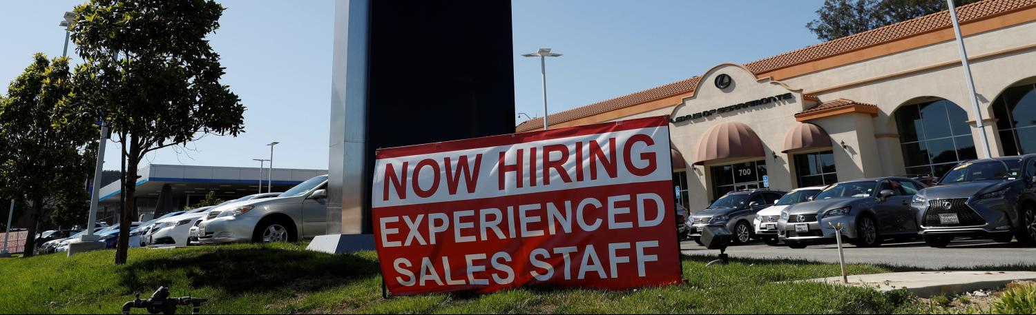 A now hiring sign is seen outside Lexus of Serramonte in Colma, California, U.S., October 3, 2017. REUTERS/Stephen Lam - RC130F2F90F0
