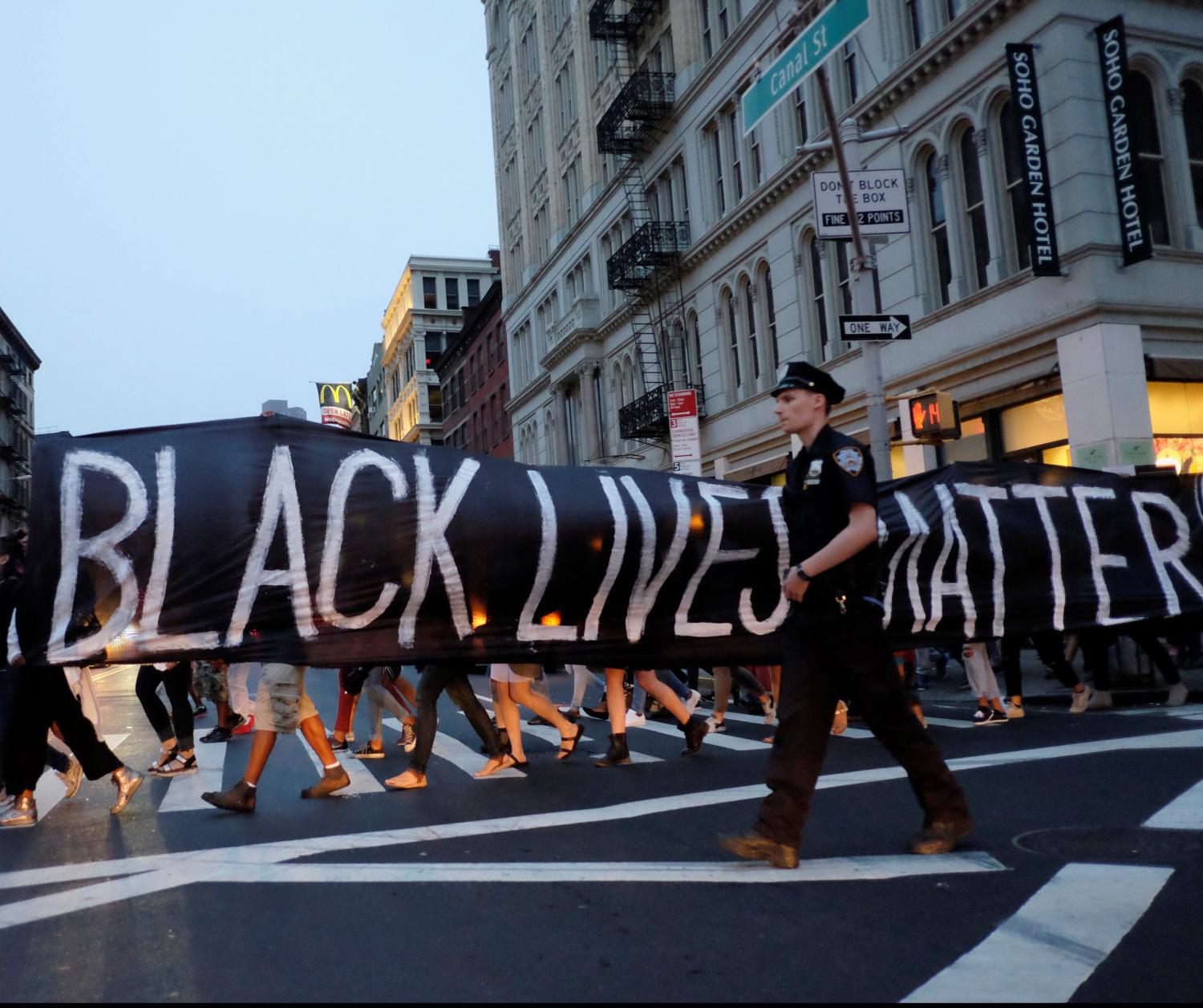 People take part in a protest against police brutality and in support of Black Lives Matter.