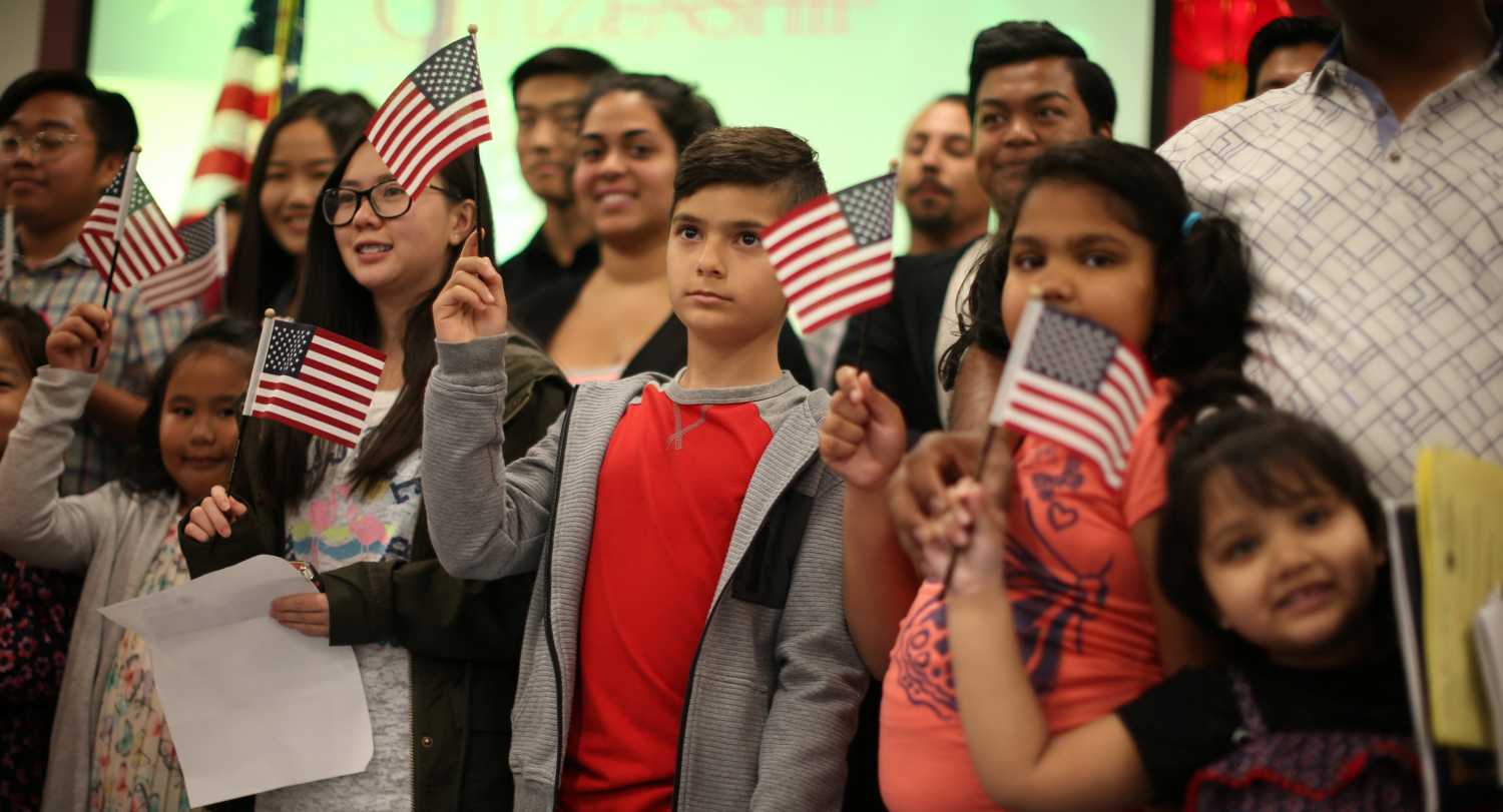 Children say the pledge of allegiance together.