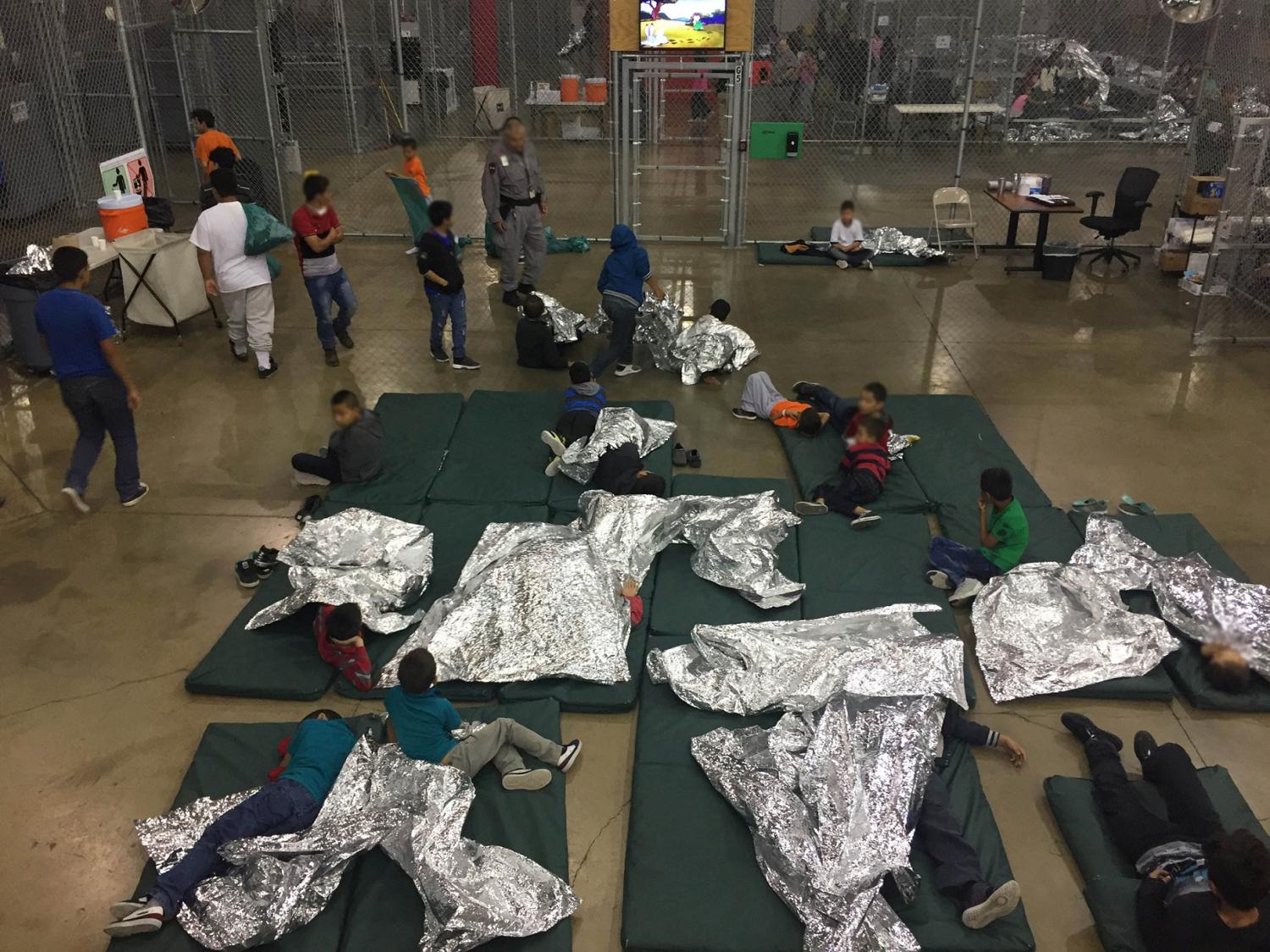 A view of inside U.S. Customs and Border Protection (CBP) detention facility shows children at Rio Grande Valley Centralized Processing Center in Rio Grande City, Texas, U.S., June 17, 2018. Picture taken on June 17, 2018.   Courtesy CBP/Handout via REUTERS   ATTENTION EDITORS - THIS IMAGE HAS BEEN SUPPLIED BY A THIRD PARTY. - RC174C9B4E40