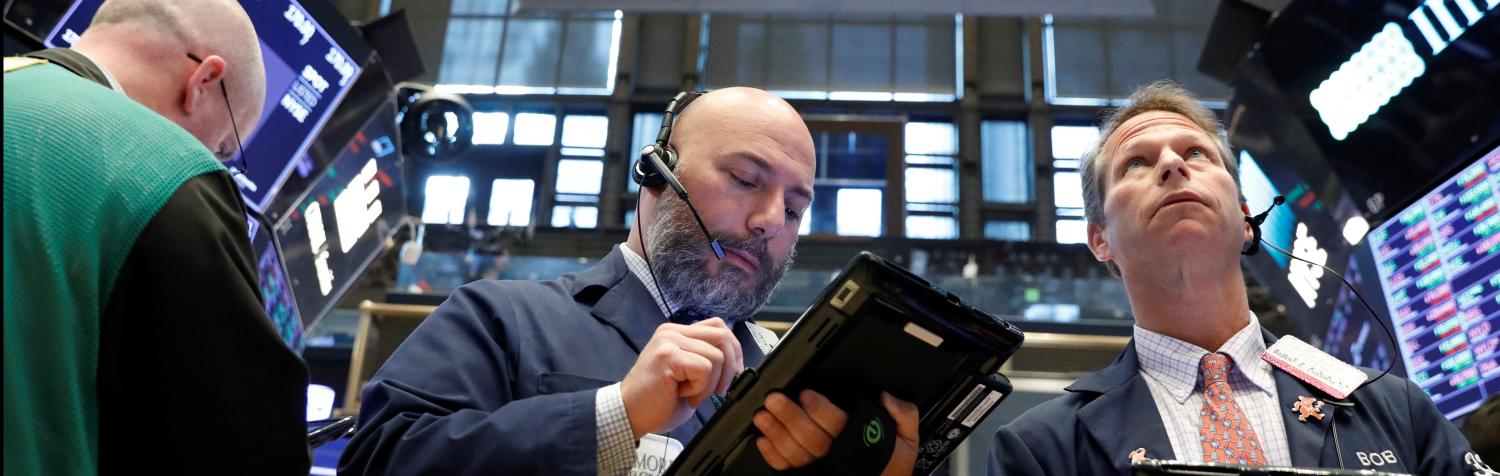 Traders work on the floor of the New York Stock Exchange (NYSE) in New York, U.S., June 19, 2018. REUTERS/Brendan McDermid - RC1FC4D89340