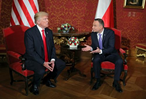 U.S. President Donald Trump talks with Polish President Andrzej Duda during their bilateral meeting, as he visits Poland for the Three Seas Initiative Summit in Warsaw, Poland July 6, 2017. REUTERS/Carlos Barria     TPX IMAGES OF THE DAY - RC135D568260