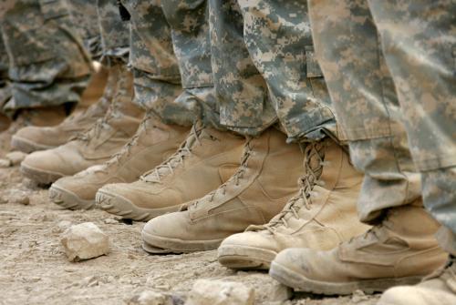 U.S. soldiers with Scout Company, 1st Battalion 30th Infantry Regiment line up before an exercise in a range at Patrol Base Murray in the Sunni neighbourhood of Arab Jabour, south Baghdad, October 20, 2007. The area around Patrol Base Murray was known as the Triangle of Death - a very safe area for al-Qaeda in Iraq to ambush Shi'ites, launch mortar and rocket attacks into the Green Zone and rig car bombs, suicide vests and other weapons for use in Baghdad. REUTERS/Fabrizio Bensch (IRAQ) - GM1DWKJHNWAA