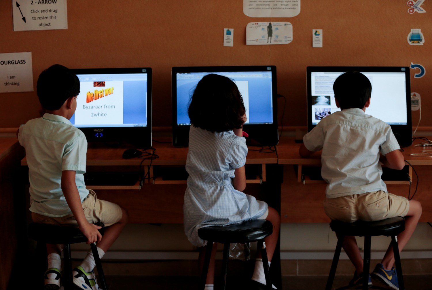 Students use computers in the technology lab at the Headstart private school in Pakistan