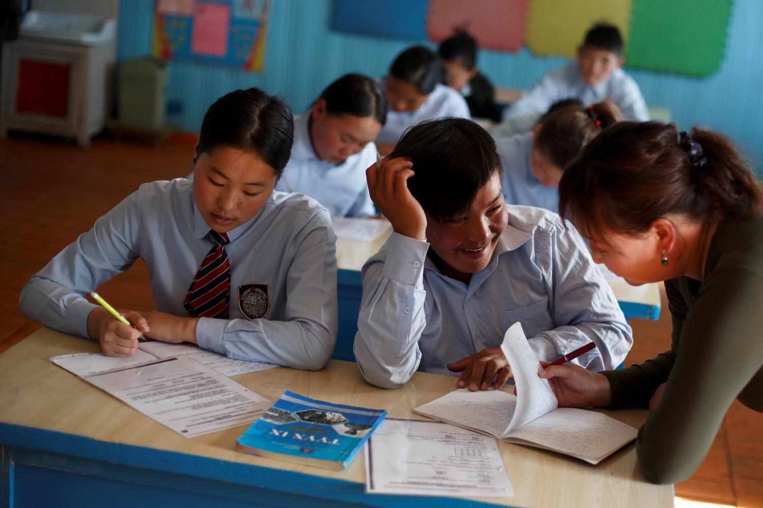 A student talks to his teacher at the village school in Tsagaannuur, Khovsgol aimag, Mongolia