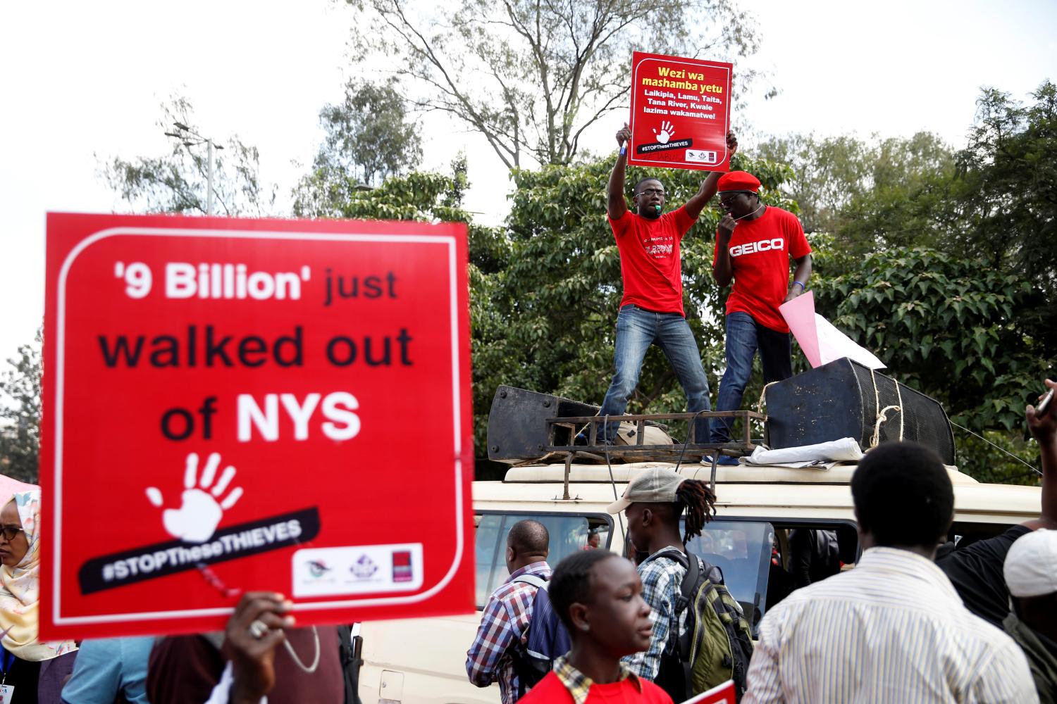 Activists march as they carry placards during a protest against corruption in Nairobi, Kenya, May 31, 2018. REUTERS/Baz Ratner - RC19DD568780