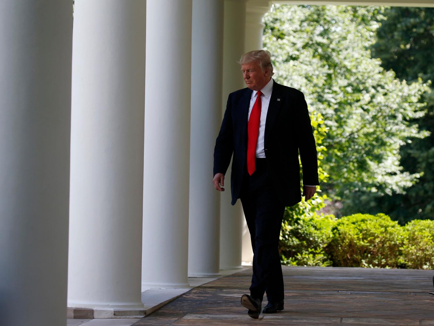 U.S. President Donald Trump arrives to announce his decision that the United States will withdraw from the landmark Paris Climate Agreement, in the Rose Garden of the White House in Washington, U.S., June 1, 2017. REUTERS/Joshua Roberts - HP1ED611IUY0I