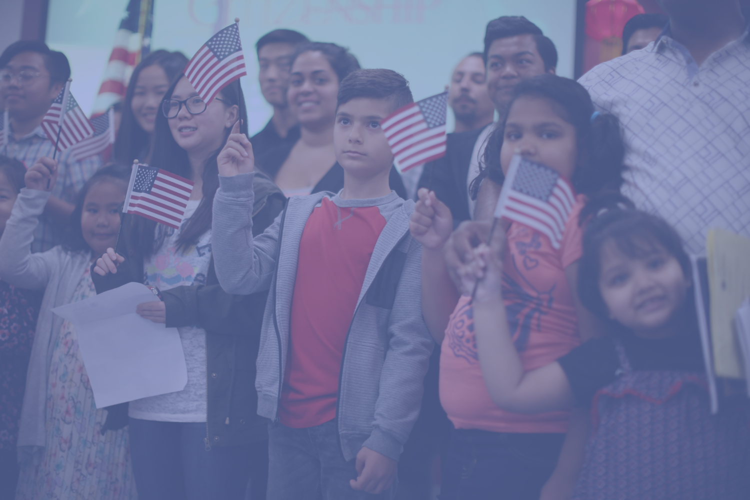 Children holding little American flags