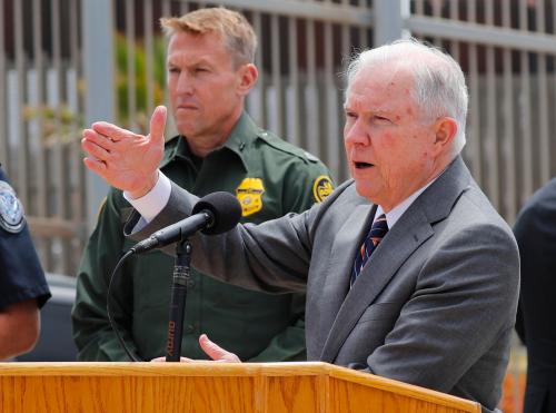 U.S. Attorney General Jeff Sessions speaks during a visit to the U.S. Mexico border wall for a press conference with Immigration and Customs Enforcement Deputy Director Thomas D. Homan, discussing immigration enforcement actions of the Trump Administration near San Diego, California, U.S. May 7, 2018. REUTERS/Mike Blake - HP1EE571L6BQV