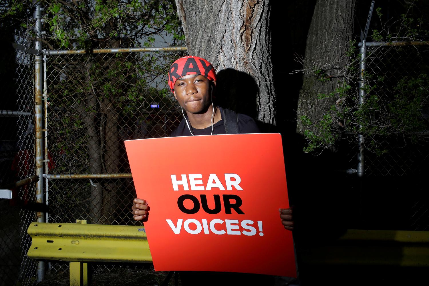 A student from Gary Comer College Prep school poses for a portrait after Pastor John Hannah of New Life Covenant Church lead a march and pray for our lives against gun violence in Chicago, Illinois, U.S., May 19, 2018. REUTERS/Joshua Lott     TPX IMAGES OF THE DAY - RC13502217F0