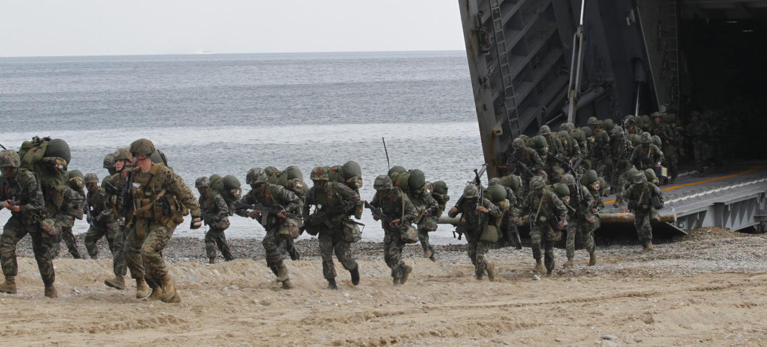 U.S. and South Korean marines participate in a joint landing operation drill in Pohang, about 370 km (230 miles) southeast of Seoul, April 26, 2013. The drill is part of the two countries' annual military training called Foal Eagle, which began on March 1 and runs until April 30. Tension has been fuelled by North Korean anger over the imposition of U.N. sanctions after its last nuclear arms test in February. The two Koreas have been technically in a state of war since a truce that ended their 1950-53 conflict. REUTERS/Lee Jae-Won (SOUTH KOREA - Tags: MILITARY POLITICS) - GM1E94Q10ZK01