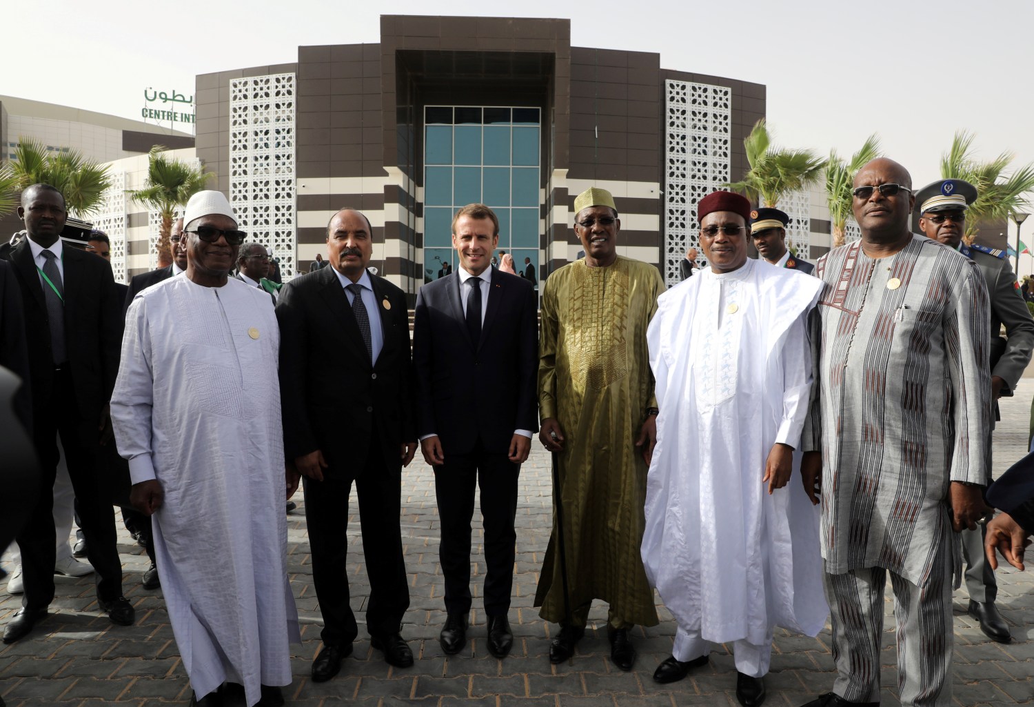 (From L) Mali's President Ibrahim Boubacar Keita, Mauritania President Mohamed Ould Abdel Aziz, French President Emmanuel Macron, Chad's President Idriss Deby, Niger's President Mahamadou Issoufou and Burkina Faso's President Roch Marc Christian Kabore pose as they leave the African Union summit to go to a meeting of the G5 Sahel "College de defense du G5 Sahel" CDS meeting in Nouakchott, Mauritania, July 2, 2018. Macron, making an exceptional appearance at an African Union (AU) summit, was expected to discuss hurdles facing a five-nation French-backed anti-terror unit, the "G5 Sahel" force.  Ludovic Marin/Pool via Reuters? - RC1B3C750F50