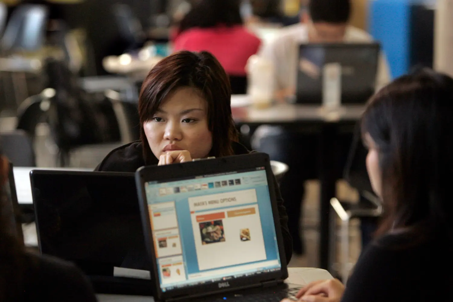 A group of students studies on the campus of San Francisco State University