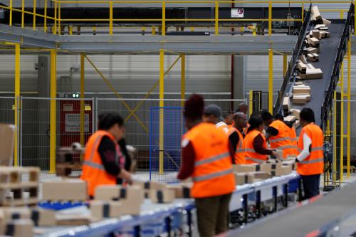 Employees sort packages at the Amazon distribution center warehouse in Saran, near Orleans, France, November 22, 2016.   REUTERS/Philippe Wojazer - RC184ABAB660