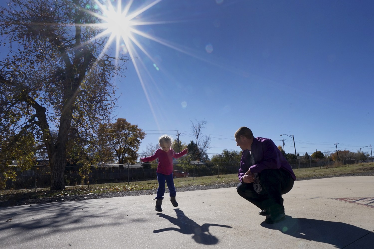 Peer 1 client Robert A. plays hopscotch with his 5-year-old daughter Isabella during Kid's Day at Peer 1 in Denver November 7, 2015. Peer 1 is a drug and alcohol rehabilitation programme for men, many having spent years in and out of prison, in Denver, Colorado. The men have often tried and failed over and over to turn their life around. With histories of abuse as children and living on the streets, they come to Peer 1 hoping to turn away from addiction and crime, to rebuild their lives and learn how to integrate into society. Treatment includes family group therapy, meditation and trust-building exercises.  REUTERS/Rick WilkingPICTURE 25 OF 26 FOR WIDER IMAGE STORY "PEER 1: PRISON, DEATH OR RECOVERY". SEARCH "PEER WILKING" FOR ALL IMAGES - GF20000082782