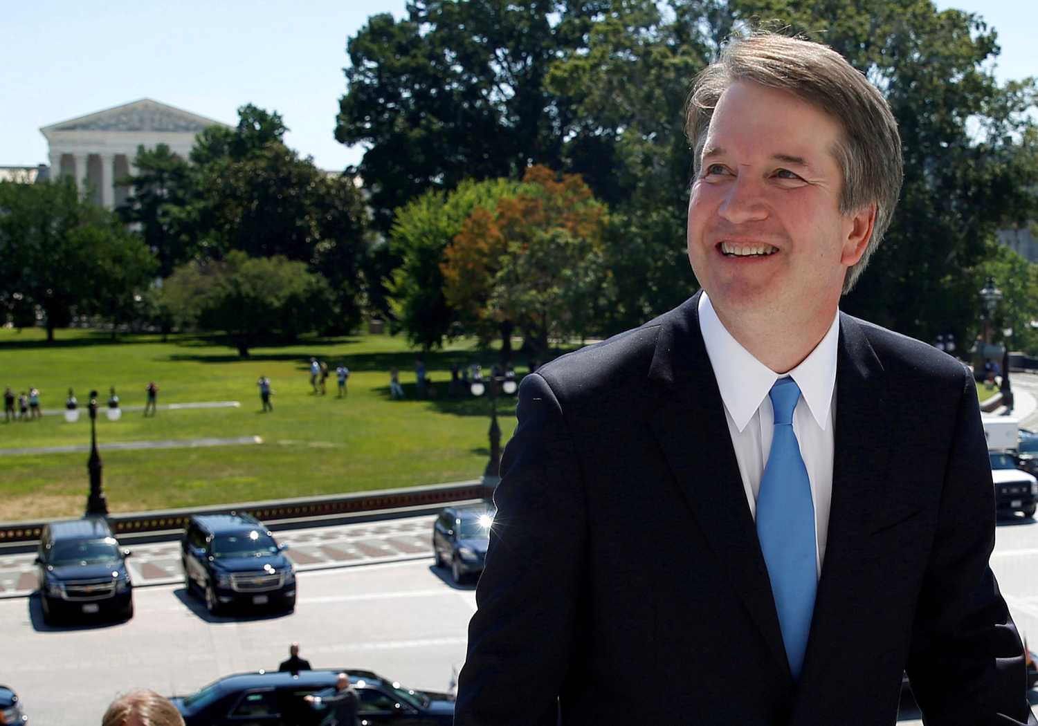 FILE PHOTO:    With the U.S. Supreme Court building in the background, Supreme Court nominee judge Brett Kavanaugh arrives prior to meeting with Senate Majority Leader Mitch McConnell on Capitol Hill in Washington, U.S., July 10, 2018. REUTERS/Joshua Roberts/File Photo - RC193B83C020