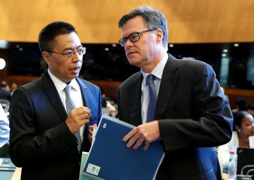 Dennis Shea (R) U.S. Ambassador to the WTO talks with Xiangchen Zhang, Chinese Ambassador to the WTO before the General Council meeting at the World Trade Organization (WTO) in Geneva, Switzerland, July 26, 2018.  REUTERS/Denis Balibouse - RC1E0D3C5680