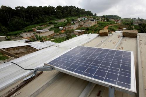 A solar panel is pictured on the roof of Jean-Noel Kouame's house, on the outer limits of the main city Abidjan's vast urban sprawl, Ivory Coast  December 18, 2017. Picture taken December 18, 2017. REUTERS/Thierry Gouegnon - RC1ECCAAF400