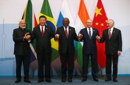 Indian Prime Minister Narendra Modi, China's President Xi Jinping, South Africa's President Cyril Ramaphosa, Russia's President Vladimir Putin and Brazil's President Michel Temer pose for a group picture at the BRICS summit meeting in Johannesburg, South Africa, July 26, 2018. REUTERS/Mike Hutchings - RC1715A90800