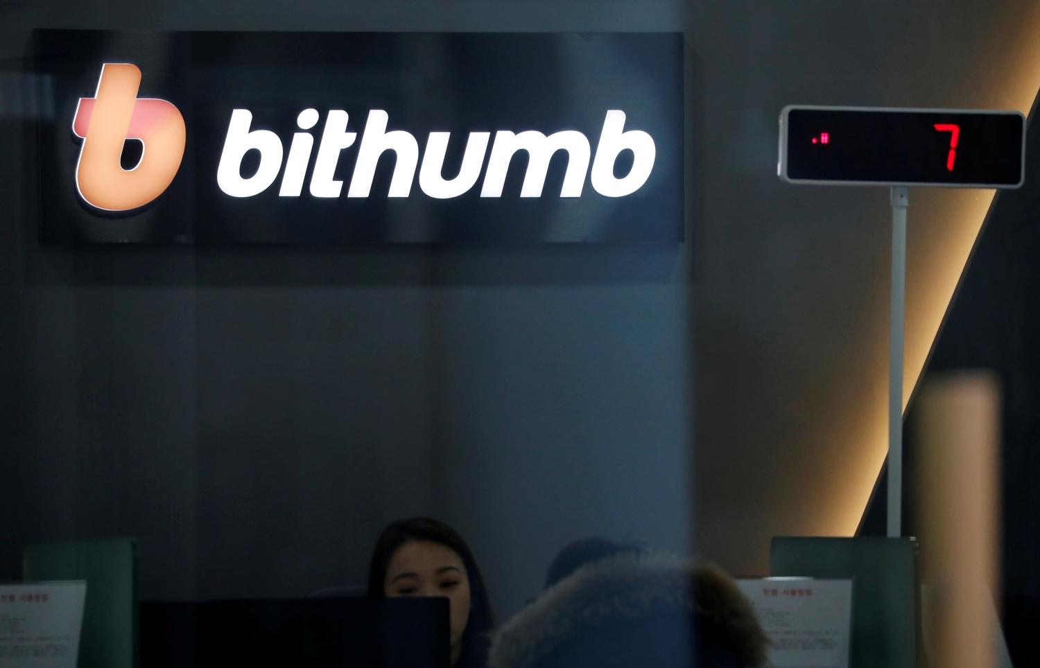 FILE PHOTO: The logo of Bithumb is seen at its cryptocurrencies exchange in Seoul, South Korea, January 11, 2018.  REUTERS/Kim Hong-Ji/File Photo - RC1BBC0AD7F0