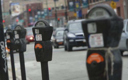 Parking meters run by LAZ Parking for Morgan Stanley are pictured in Chicago March 18, 2009. As they struggle to close ballooning budget deficits amid the worst financial crisis since the Great Depression, many U.S. state and local governments will be tempted to follow the example of Chicago. The third-largest U.S. city has raised billions of dollars in recent years turning public assets to private businesses that then run them as for-profit enterprises. Picture taken March 18, 2009. To match feature USA-PRIVATIZATIONS/    REUTERS/John Gress (UNITED STATES BUSINESS) - GM1E53K0O0601