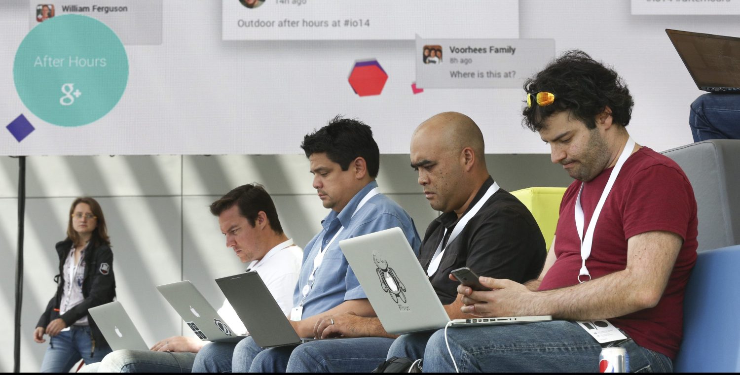 Attendees use their laptops at the Google I/O developers conference in San Francisco.