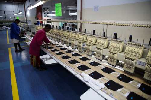 Employees work on the manufacturing line at the United Aryan Export Processing Zone textile factory in Nairobi, Kenya April 13, 2017. Picture taken April 13, 2017. REUTERS/Baz Ratner - RC116416CF10