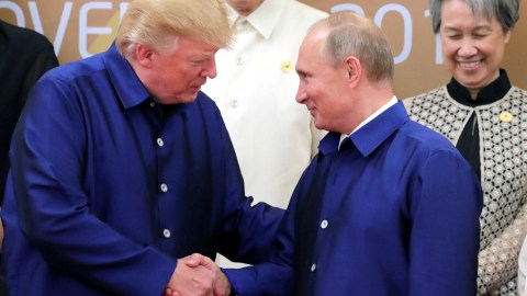 U.S. President Donald Trump and Russian President Vladimir Putin shake hands as they take part in a family photo at the APEC summit in Danang, Vietnam November 10, 2017. Sputnik/Mikhail Klimentyev/Kremlin via REUTERS ATTENTION EDITORS - THIS IMAGE WAS PROVIDED BY A THIRD PARTY.     TPX IMAGES OF THE DAY - RC18A81CDA80