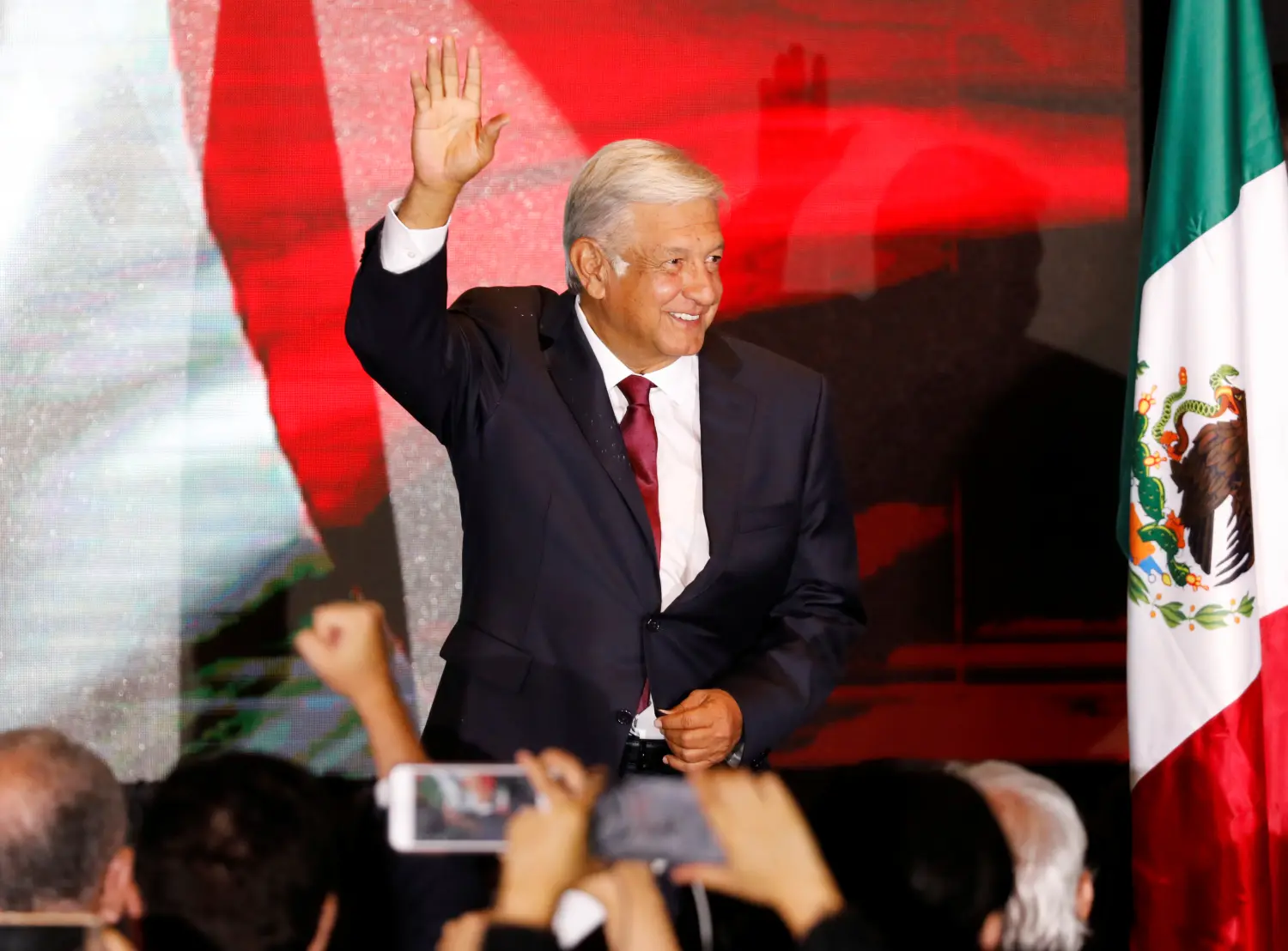 Presidential candidate Andres Manuel Lopez Obrador waves as he addresses supporters after polls closed in the presidential election, in Mexico City, Mexico July 1, 2018.   REUTERS/Carlos Jasso - RC1BC0E9AAC0