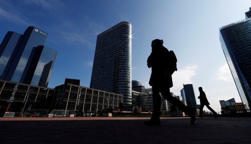 People walk on the esplanade of La Defense in the financial and business district of La Defense, west of Paris, France March 26, 2018. REUTERS/Gonzalo Fuentes - RC1D39CFF000