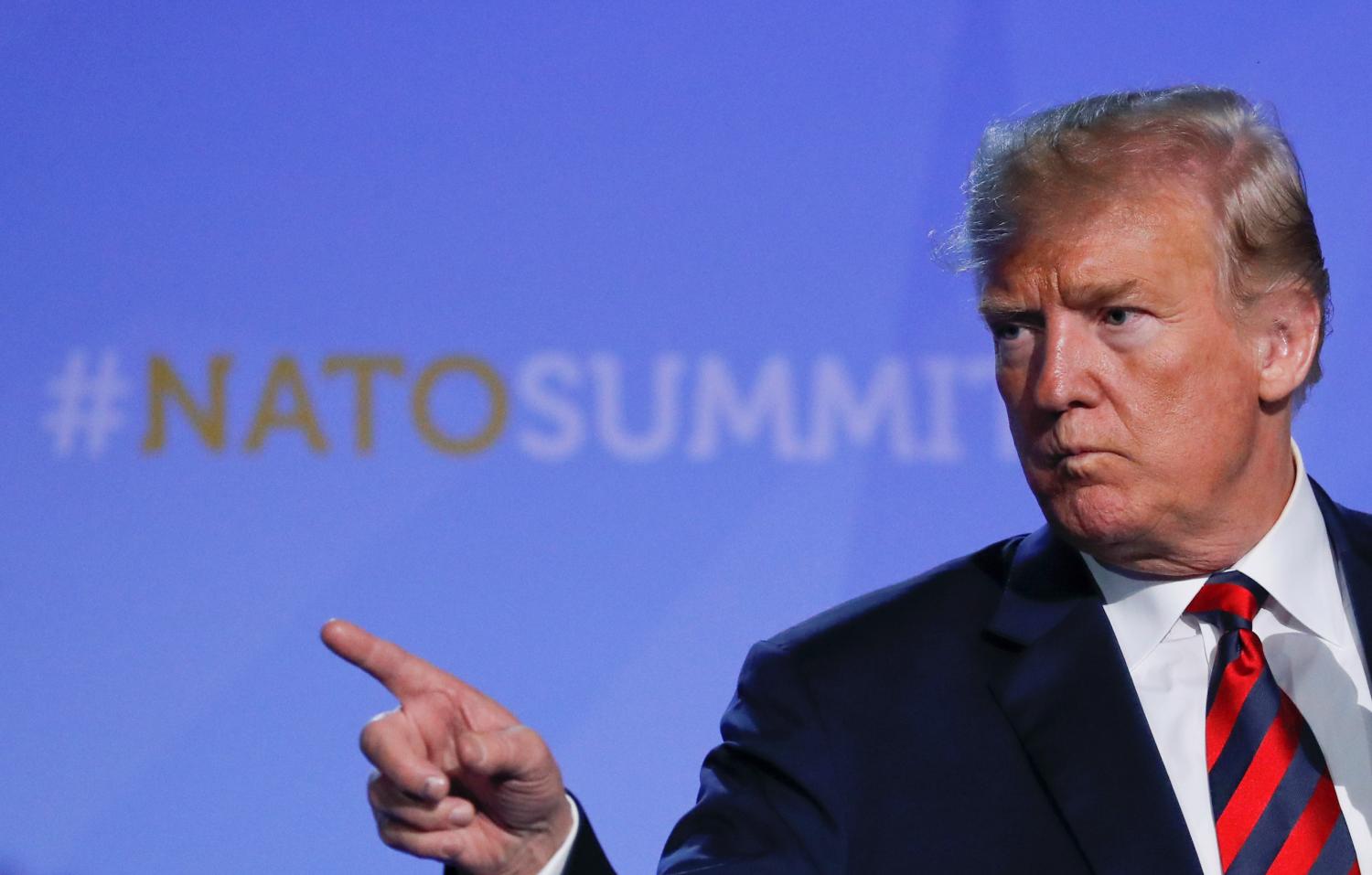 U.S. President Donald Trump gestures as he holds a news conference after participating in the NATO Summit in Brussels, Belgium July 12, 2018. REUTERS/Yves Herman - RC1985E95E90