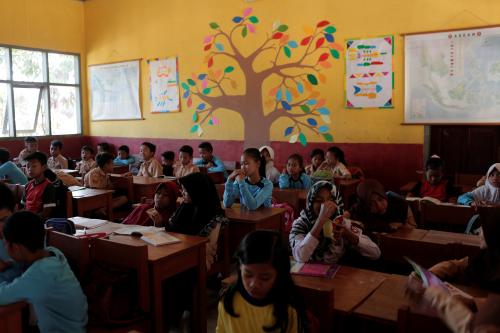 Students sit in a classroom at Cikawao village in Majalaya, West Java province, Indonesia, September 23, 2017. REUTERS/Beawiharta - RC161B9B0000
