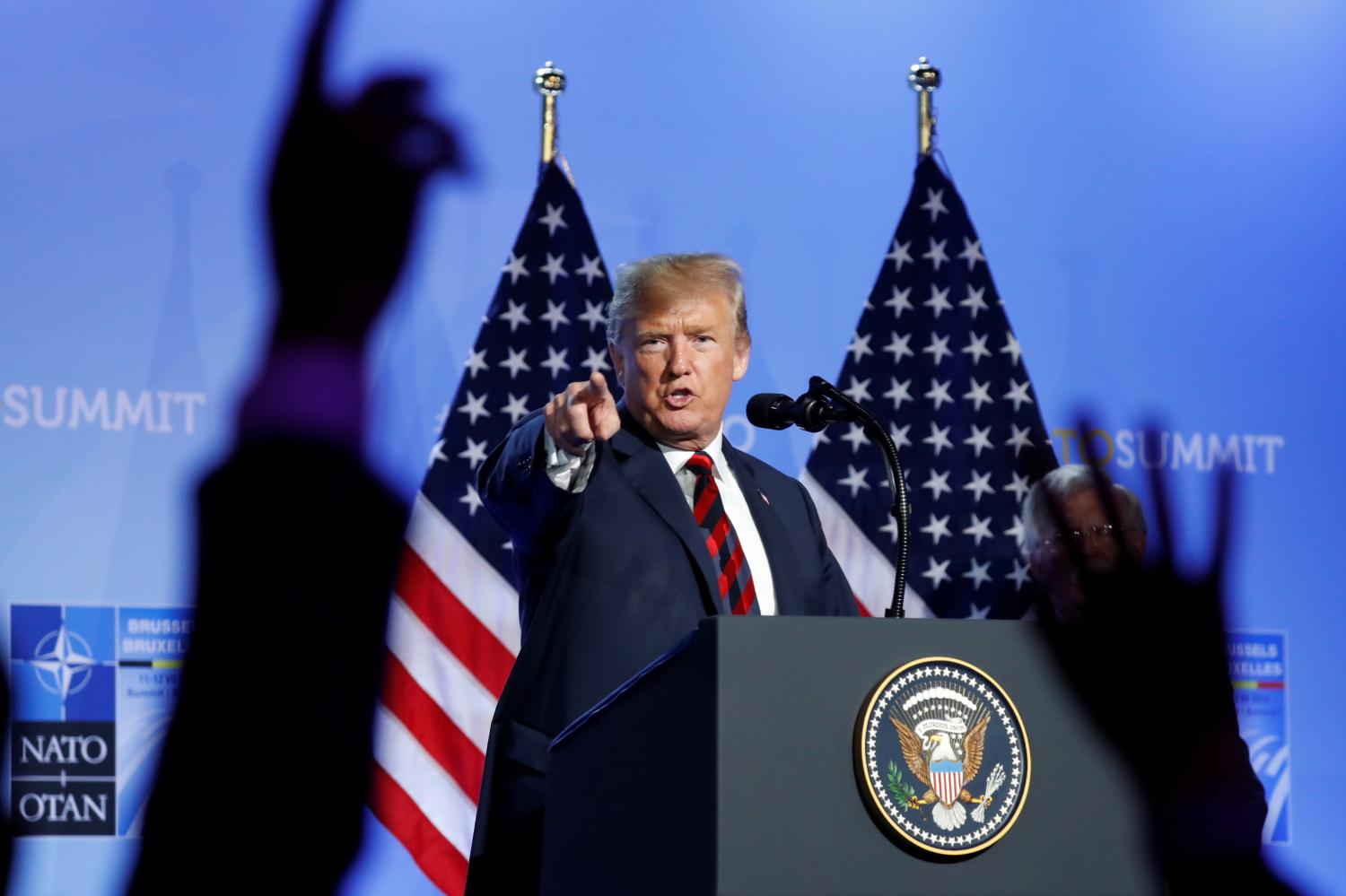 U.S. President Donald Trump takes questions from the media during a news conference after participating in the NATO Summit in Brussels, Belgium July 12, 2018. REUTERS/Kevin Lamarque - RC1988096060