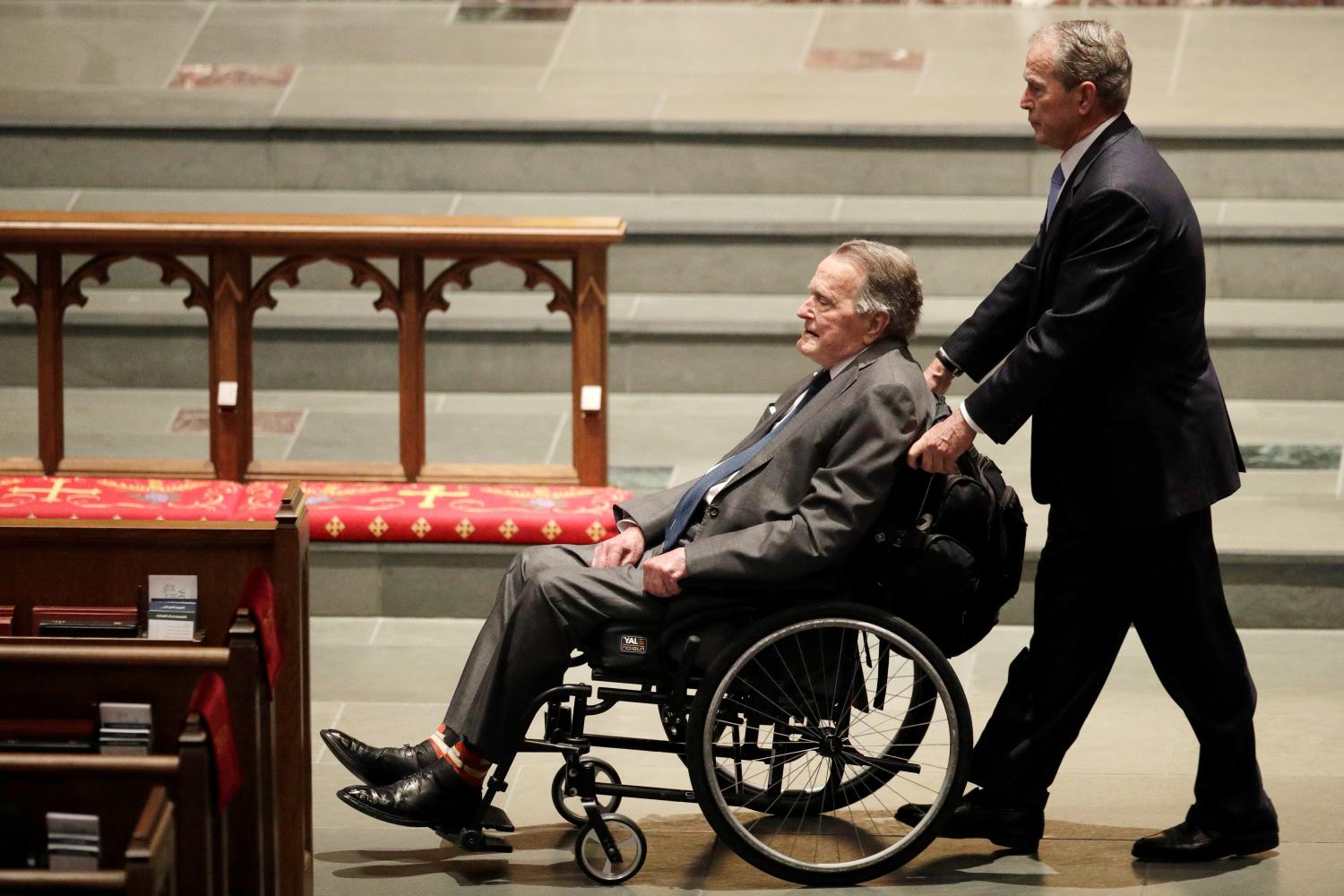 Former Presidents George W. Bush, and George H.W. Bush arrive at St. Martin's Episcopal Church for funeral services for former first lady Barbara Bush in Houston, Texas, U.S., April 21, 2018.   David J. Phillip/Pool via Reuters - RC19CCE88350