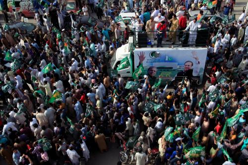 Supporters of the Pakistan Muslim League - Nawaz (PML-N) chant and march towards the airport to welcome ousted Prime Minister Nawaz Sharif and his daughter Maryam, in Lahore, Pakistan July 13, 2018. REUTERS/Mohsin Raza - RC17840893C0