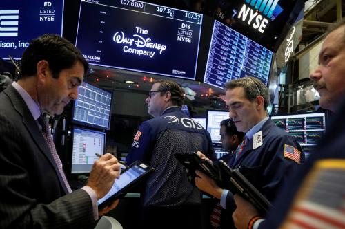 Traders work at the post where Walt Disney Co. stock is traded on the floor of the New York Stock Exchange (NYSE) in New York, U.S., December 14, 2017. REUTERS/Brendan McDermid - RC1889B0E830