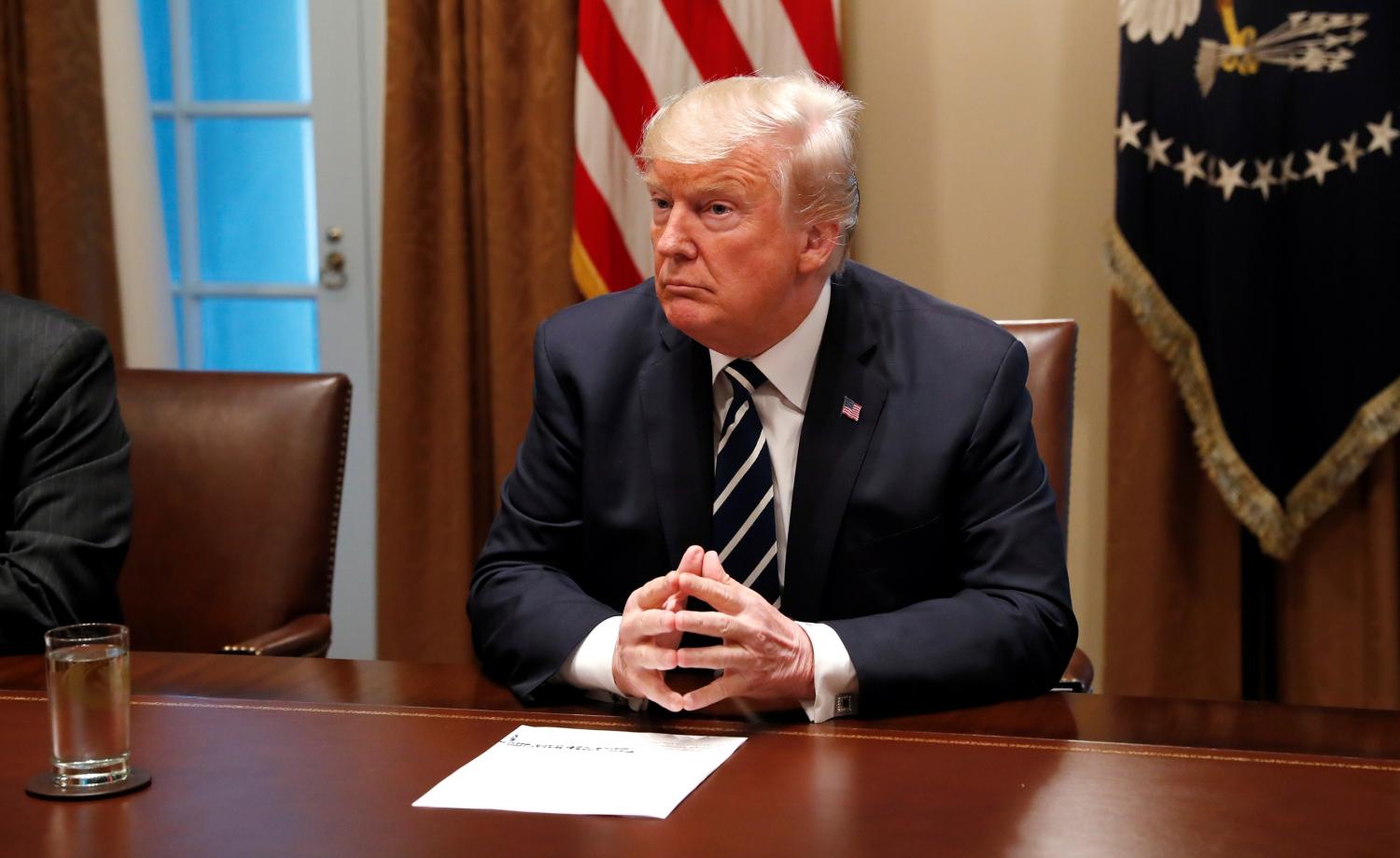 U.S. President Donald Trump awaits the start of a meeting with members of the U.S. Congress at the White House in Washington, July 17, 2018.   REUTERS/Leah Millis - RC1C1DA39DE0