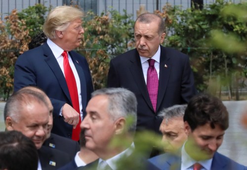 U.S. President Donald Trump, Turkish President Tayyip Erdogan and Canada's Prime Minister Justin Trudeau are seen at the start of the NATO summit in Brussels, Belgium July 11, 2018.   REUTERS/Reinhard Krause - RC1C67E741D0