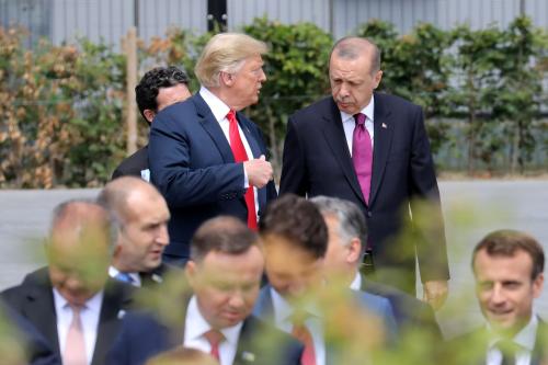 U.S. President Donald Trump speaks withh Turkey's President Tayyip Erdogan ahead of the opening ceremony of the NATO (North Atlantic Treaty Organization) summit, at the NATO headquarters in Brussels, Belgium, July 11, 2018.  Ludovic Marin/Pool via REUTERS - RC188FED2910