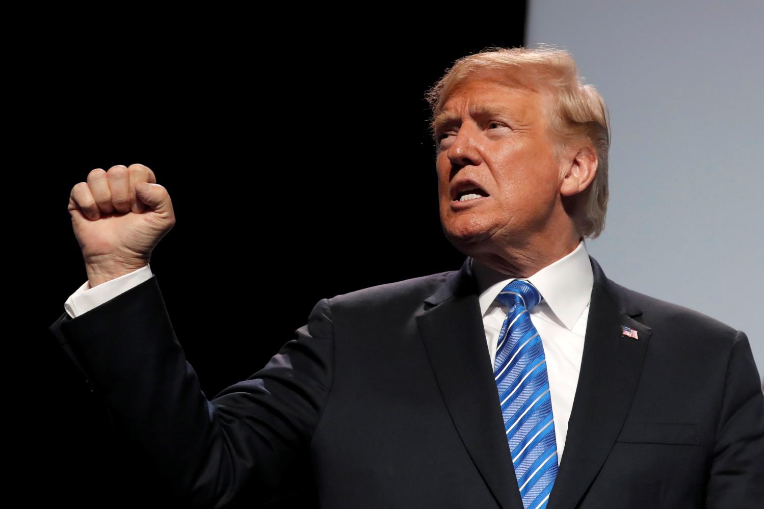 U.S. President Donald Trump gestures as he addresses the Veterans of Foreign Wars 119th VFW national convention in Kansas City, Missouri, U.S., July 24, 2018. REUTERS/Carlos Barria - RC1B6B27E100