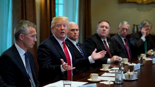 Seated with members of his Cabinet, U.S.  President Donald Trump speaks during a meeting with NATO Secretary General Jens Stoltenberg (L) at the White House in Washington. U.S., May 17, 2018. REUTERS/Kevin Lamarque - RC1BBC3BA300