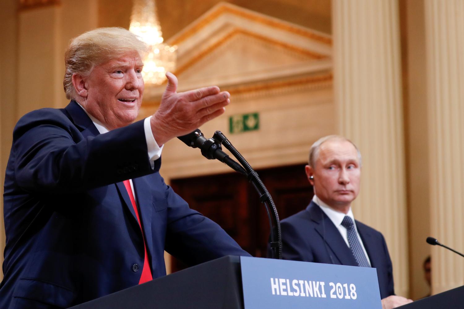 U.S. President Donald Trump gestures during a joint news conference with Russia's President Vladimir Putin after their meeting in Helsinki, Finland, July 16, 2018. REUTERS/Kevin Lamarque - RC11FBFEF700