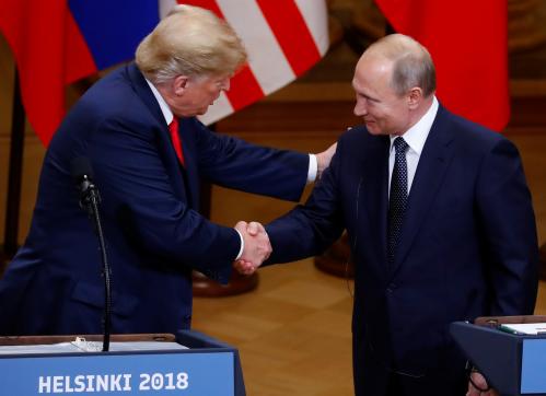 U.S. President Donald Trump and Russian President Vladimir Putin shake hands as they hold a joint news conference after their meeting in Helsinki, Finland, July 16, 2018. REUTERS/Leonhard Foeger - RC1C0A78A3A0